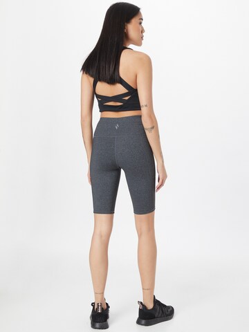 SKECHERS Skinny Sportbroek in Grijs