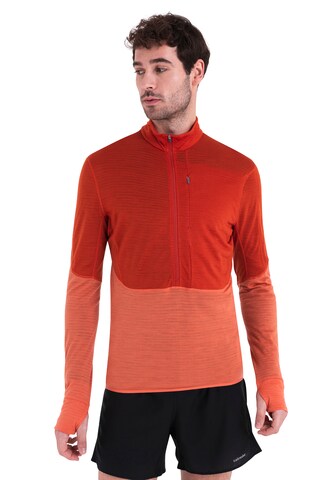 ICEBREAKER - Camiseta funcional 'Realfleece Descender' en naranja: frente