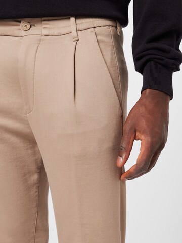DRYKORN Regular Pleat-front trousers 'Chasy' in Beige