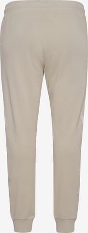 Effilé Pantalon de sport 'LEGACY' Hummel en beige