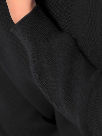 Goldner Pullover in Schwarz