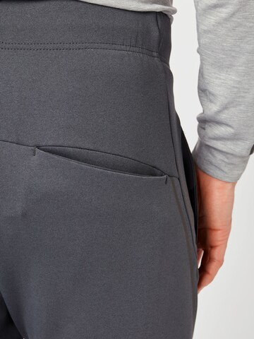 Effilé Pantalon de sport OAKLEY en gris