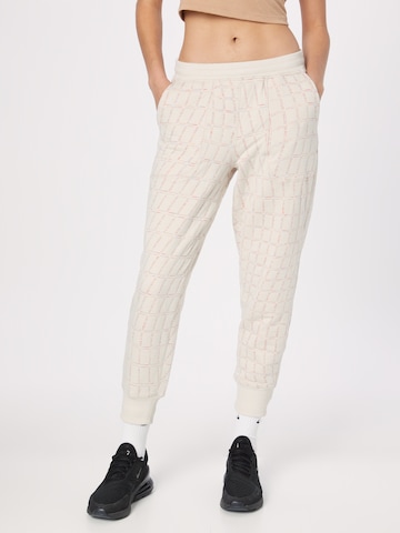 NIKE Tapered Sports trousers in White: front