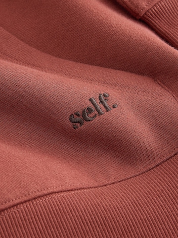 self. - Sudadera en marrón