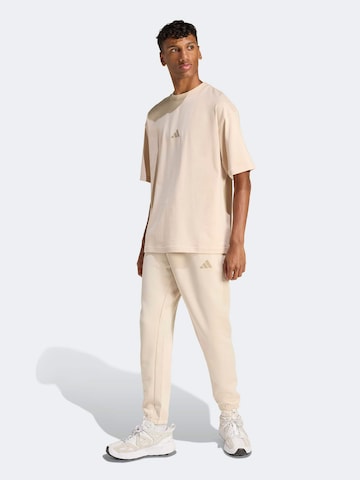 ADIDAS SPORTSWEAR Tapered Sportnadrágok - bézs: elől