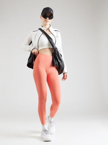 Skinny Pantaloni sport de la DKNY Performance pe portocaliu