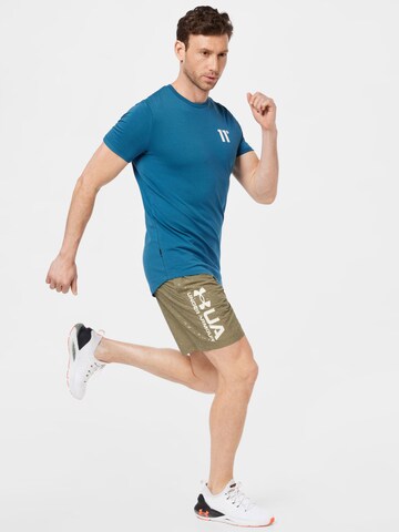 UNDER ARMOUR Regular Sports trousers in Green