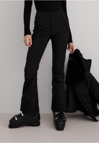 évasé Pantalon de sport Aim'n en noir