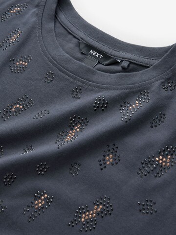 Tricou de la Next pe gri