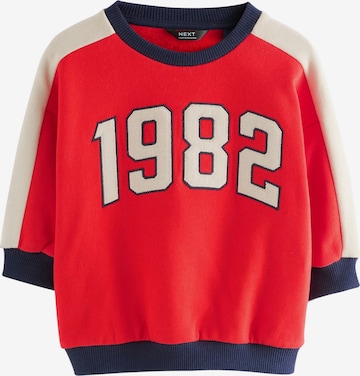 Next Collegepaita värissä punainen: etupuoli