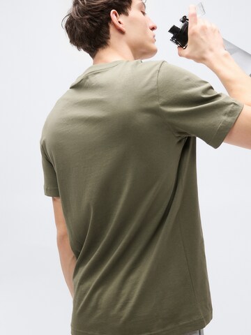 PUMA Functioneel shirt 'Essentials No.1' in Groen