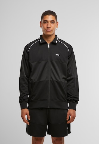 Unfair Athletics Between-season jacket 'Center Court Tracktop' in Black: front