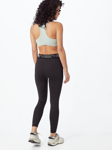 PUMA Skinny Sportbroek in Zwart