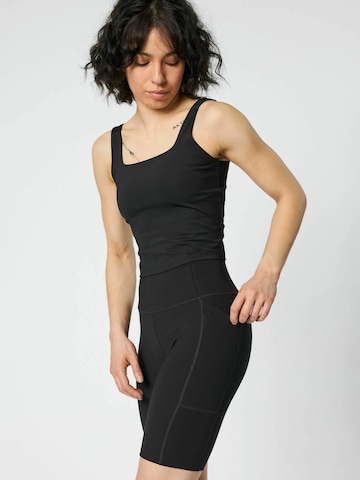 Girlfriend Collective Skinny Sportbroek in Zwart: voorkant