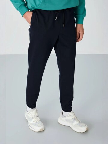 Tommy Life Sportnadrágok 'Jogginghose' - fekete