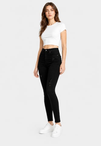 Skinny Jeans di Elara in nero