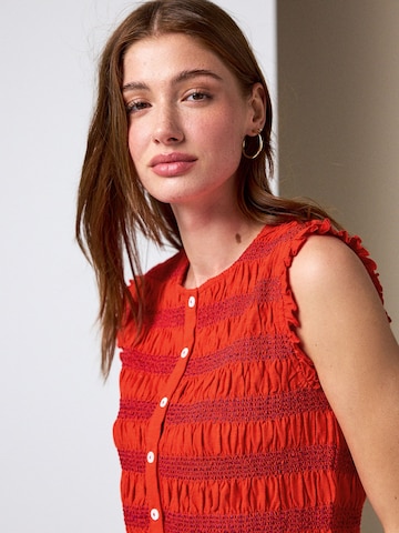 Haut Next en rouge