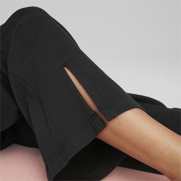 PUMA Loose fit Sports trousers in Black