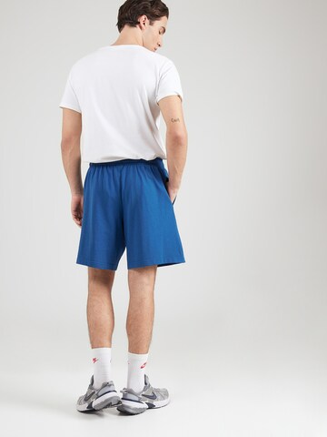 Nike Sportswear Lużny krój Spodnie 'Club' w kolorze niebieski