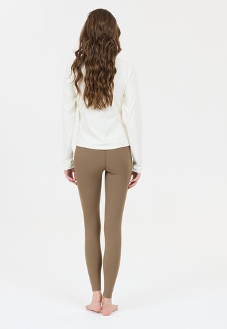 Athlecia Skinny Sports trousers 'Luxe' in Brown