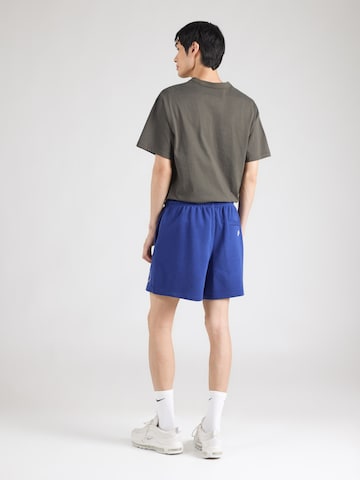 Nike SportswearLoosefit Hlače 'Club' - plava boja