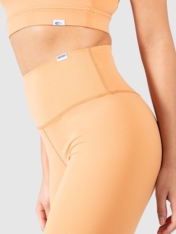 Smilodox Skinny Sportbroek 'Caprice' in Oranje