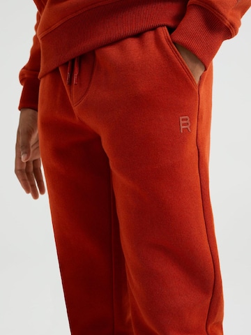 WE Fashion Tapered Trousers in Orange