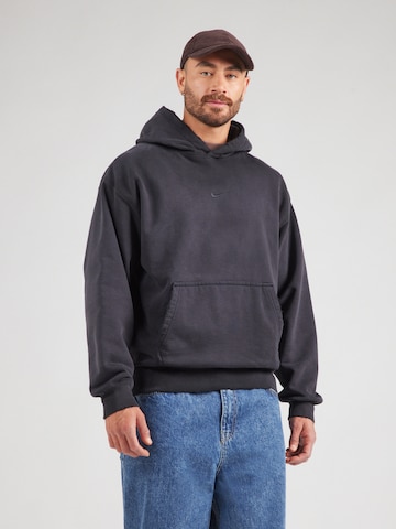 Nike Sportswear - Sudadera en negro: frente