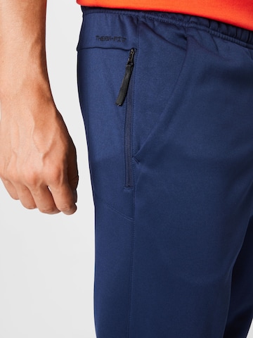 NIKE Tapered Sportbroek in Blauw