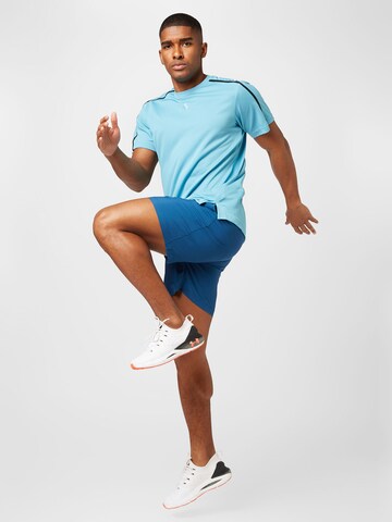 UNDER ARMOUR - Regular Calças de desporto em azul