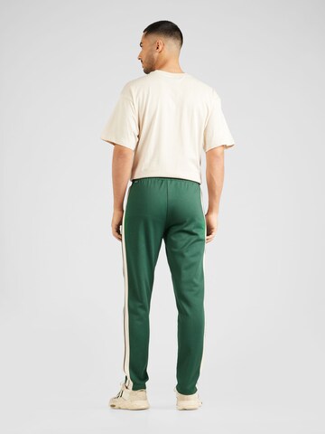 ELLESSE Slimfit Spodnie 'Luxor' w kolorze zielony