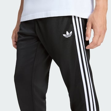 ADIDAS ORIGINALS Дънки Tapered Leg Панталон 'SST' в черно