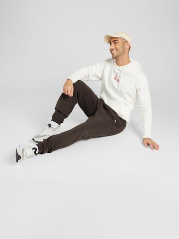 NEW ERA Tapered Broek 'LEAGUE ESSENTIALS' in Bruin