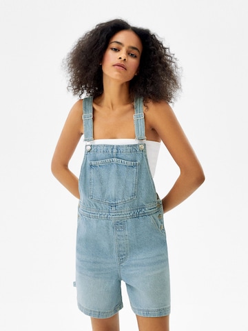 Bershka Regular Dungaree jeans in Blue: front