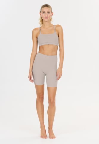 Athlecia Slim fit Sports trousers 'Blossom' in Beige