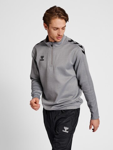 Hummel - Camiseta deportiva en gris: frente