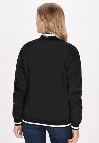 urban rain by Schmuddelwedda Between-season jacket in Black