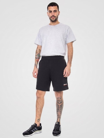 ADIDAS Luźne Spodnie 'ADV' w kolorze czarny