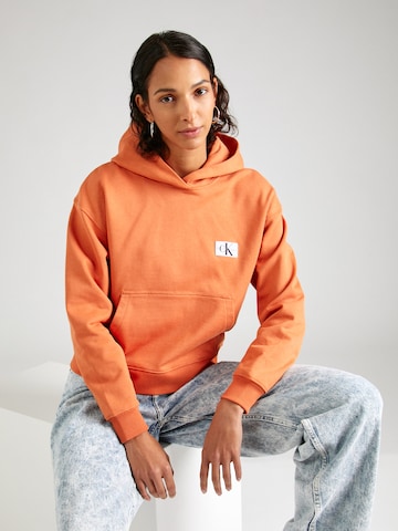 Calvin Klein Jeans Суичър в оранжево: отпред