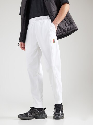 NIKE Zwężany krój Spodnie sportowe 'HERITAGE' w kolorze biały: przód