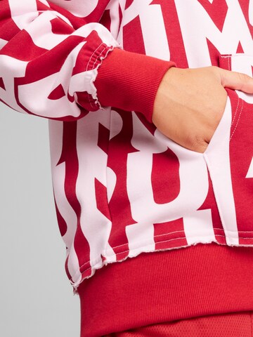 PUMA Sports sweatshirt 'Arc-hitect' in Red