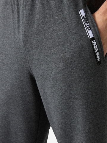 Pantaloni sportivi di Tommy Life in grigio