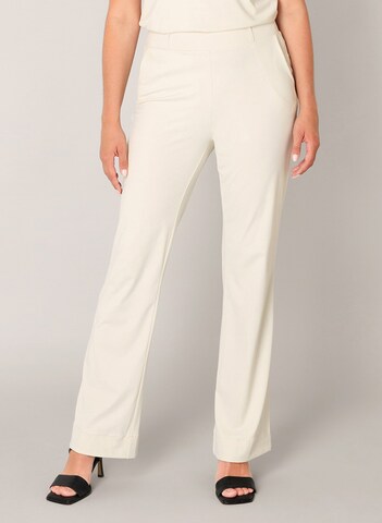 BASE LEVEL Flared Pants in White: front