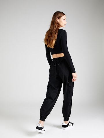 Tapered Pantaloni eleganți de la River Island pe negru