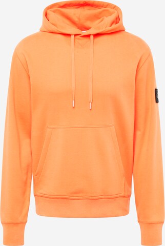 Sweat-shirt Calvin Klein Jeans en orange : devant