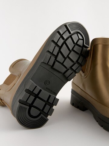 Next - Botas de lluvia en oro