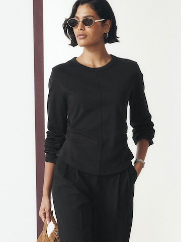 Wide leg Pantaloni con pieghe di Next in nero