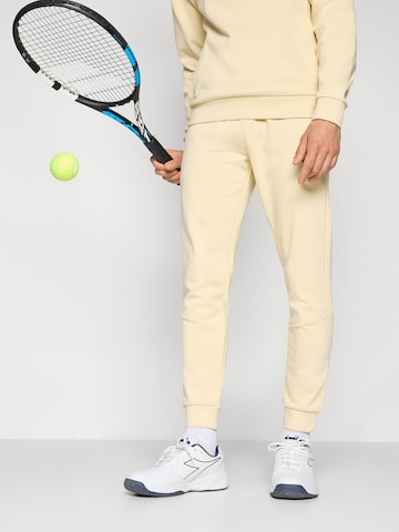 Regular Pantaloni sport 'BOLD 025' de la Sergio Tacchini pe bej