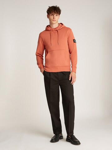 Felpa di Calvin Klein Jeans in arancione