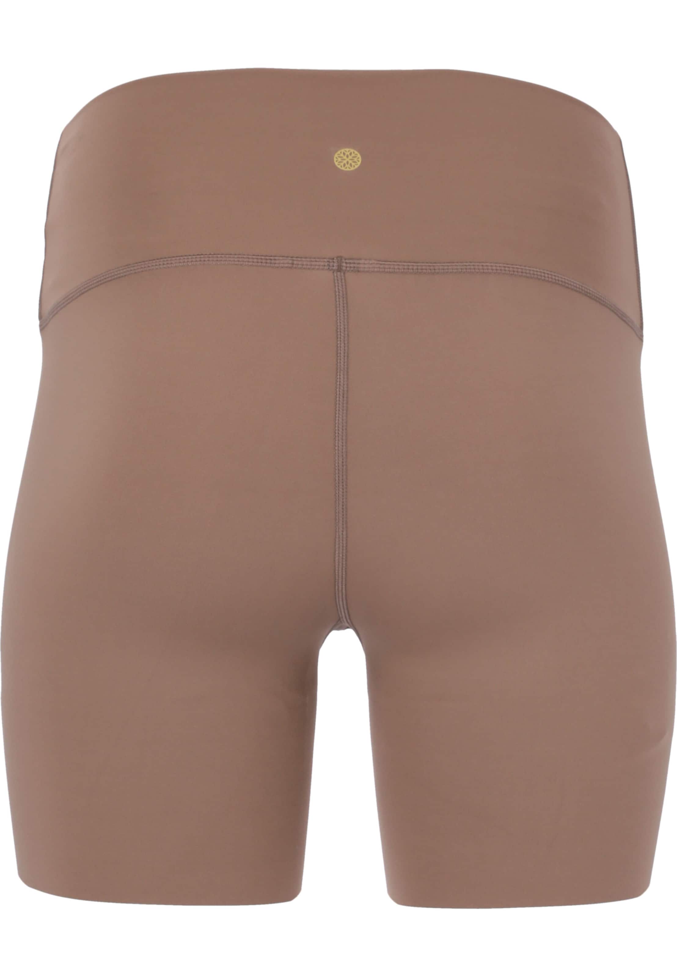 Athlecia Skinny Spodnie sportowe 'Almy' w kolorze brązowy